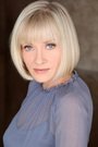 Barbara Crampton isEvelyn