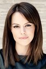 Emily Hampshire isJennifer Goines