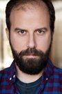 Brett Gelman isGreg